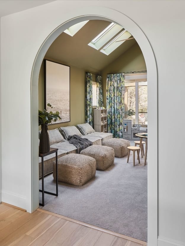 Arched doorway living room skylights