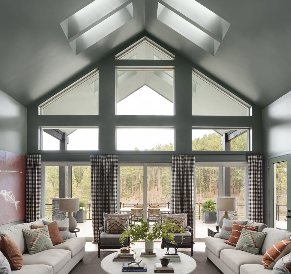 Four skylights on a covered porch bring light to an adjacent living room.