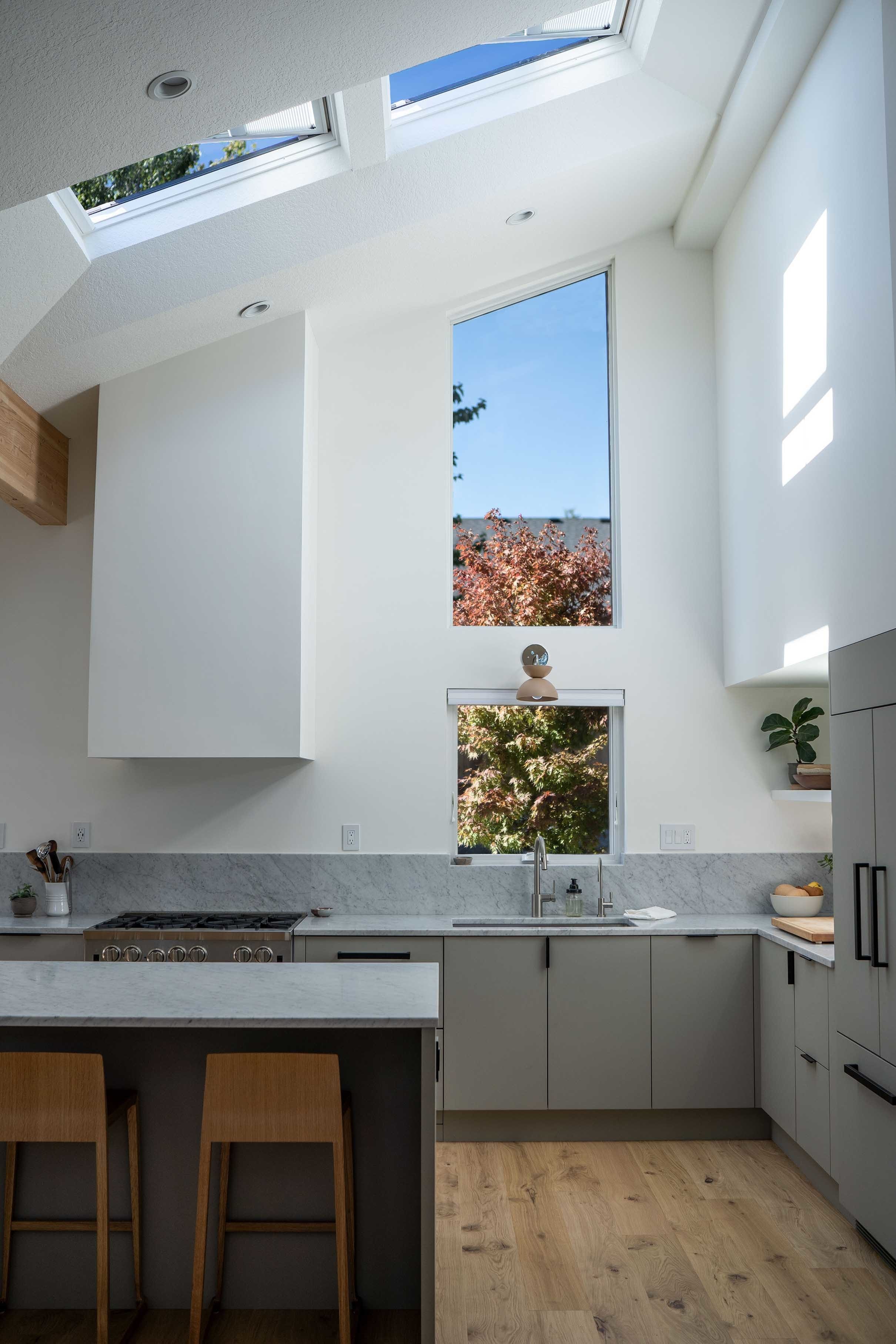 wide view of kitchen with two skylights