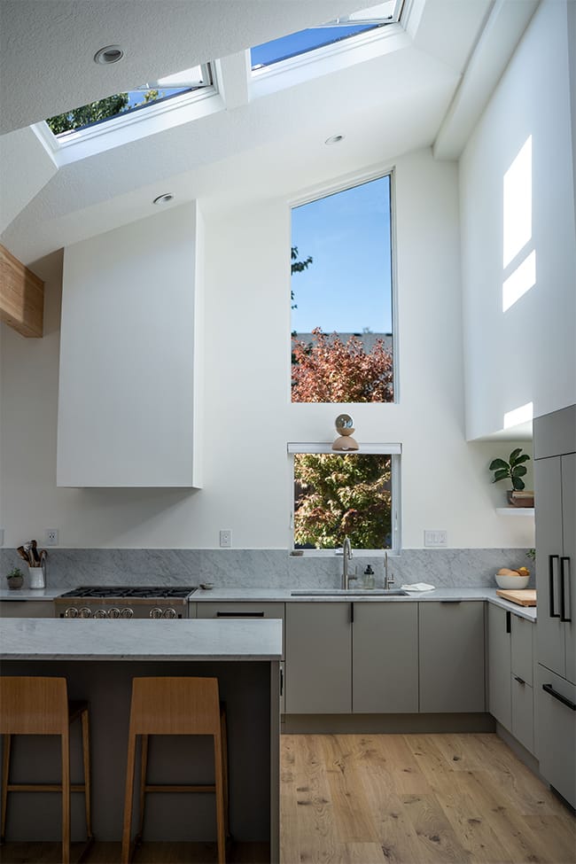 Kitchen with two skylights white gray