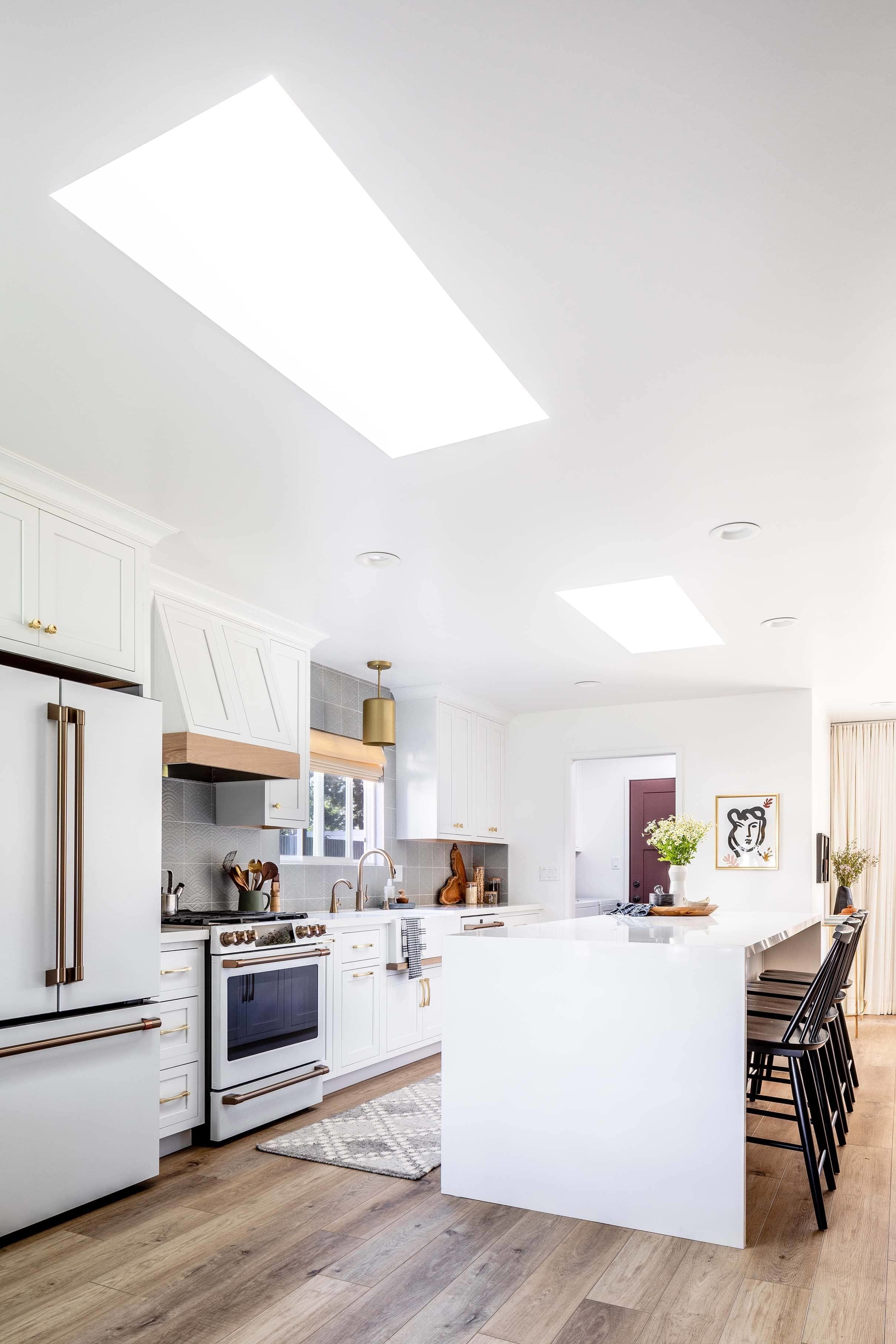 White kitchen with skylights
