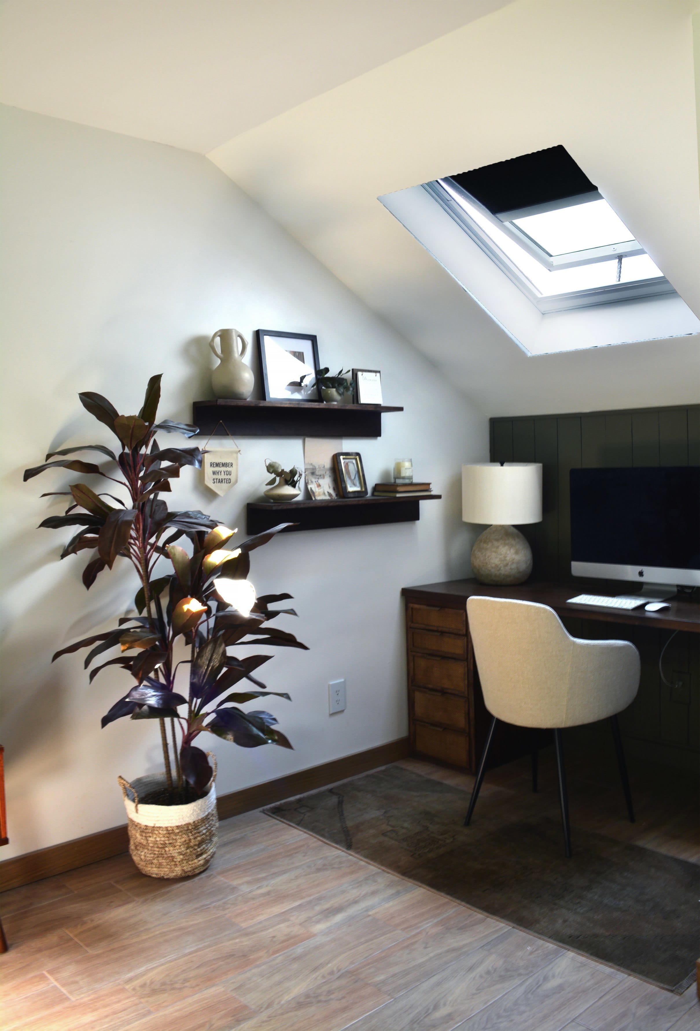 Desk in a nook with a skylight overhead
