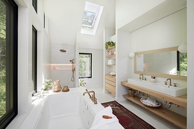 Bathroom with skylight over shower bathtub vanity