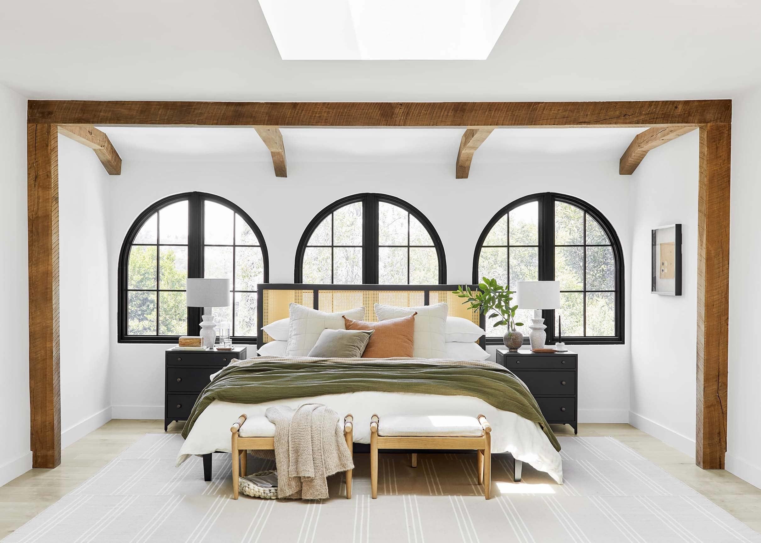 Bedroom white black wood skylight green blanket