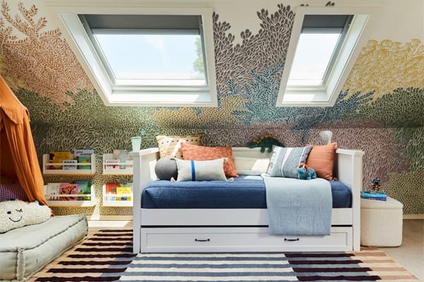 Childrens room with skylights and colorful tree themed wallpaper TMB