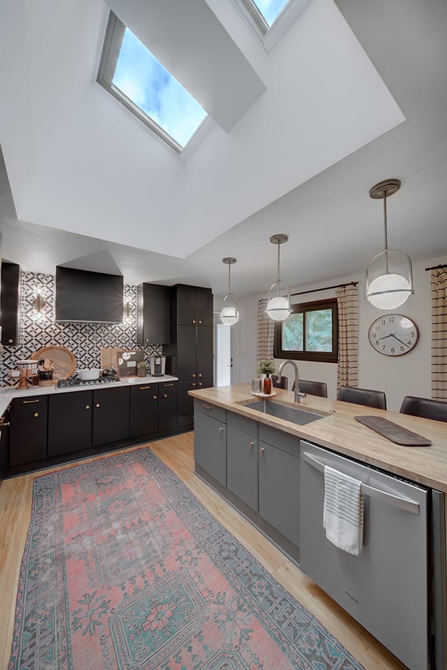 Kitchen two skylights black cabinets