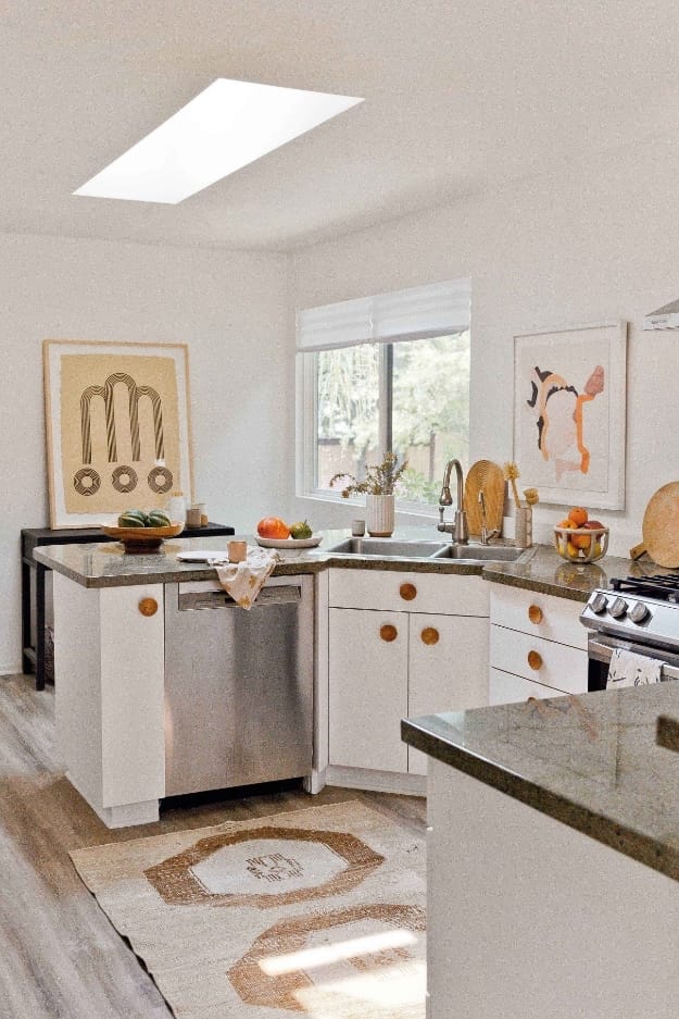 Kitchen with skylight hamza artwork wood floor