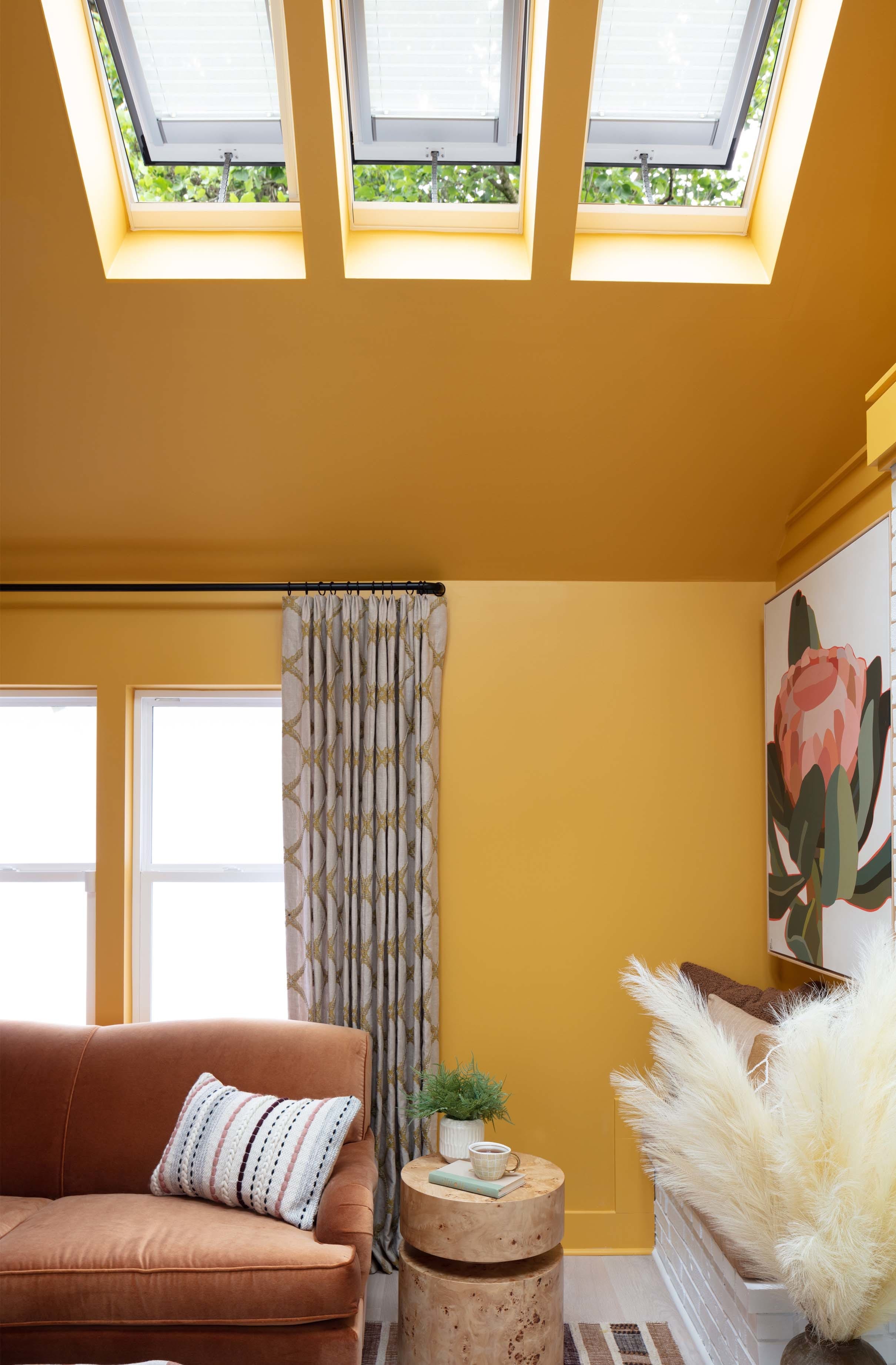 Living room skylights yellow wall ceiling