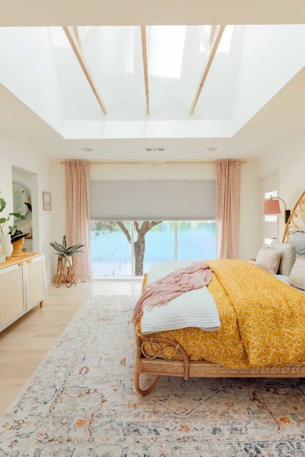 Main bedroom skylights exposed trusses yellow pink