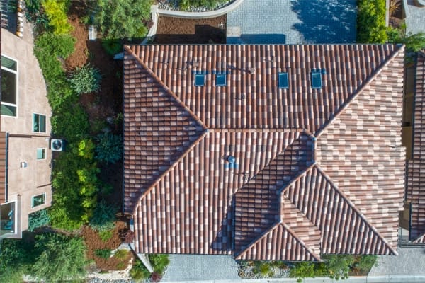 Overhead view of a spanish tile roof with skylights TMB