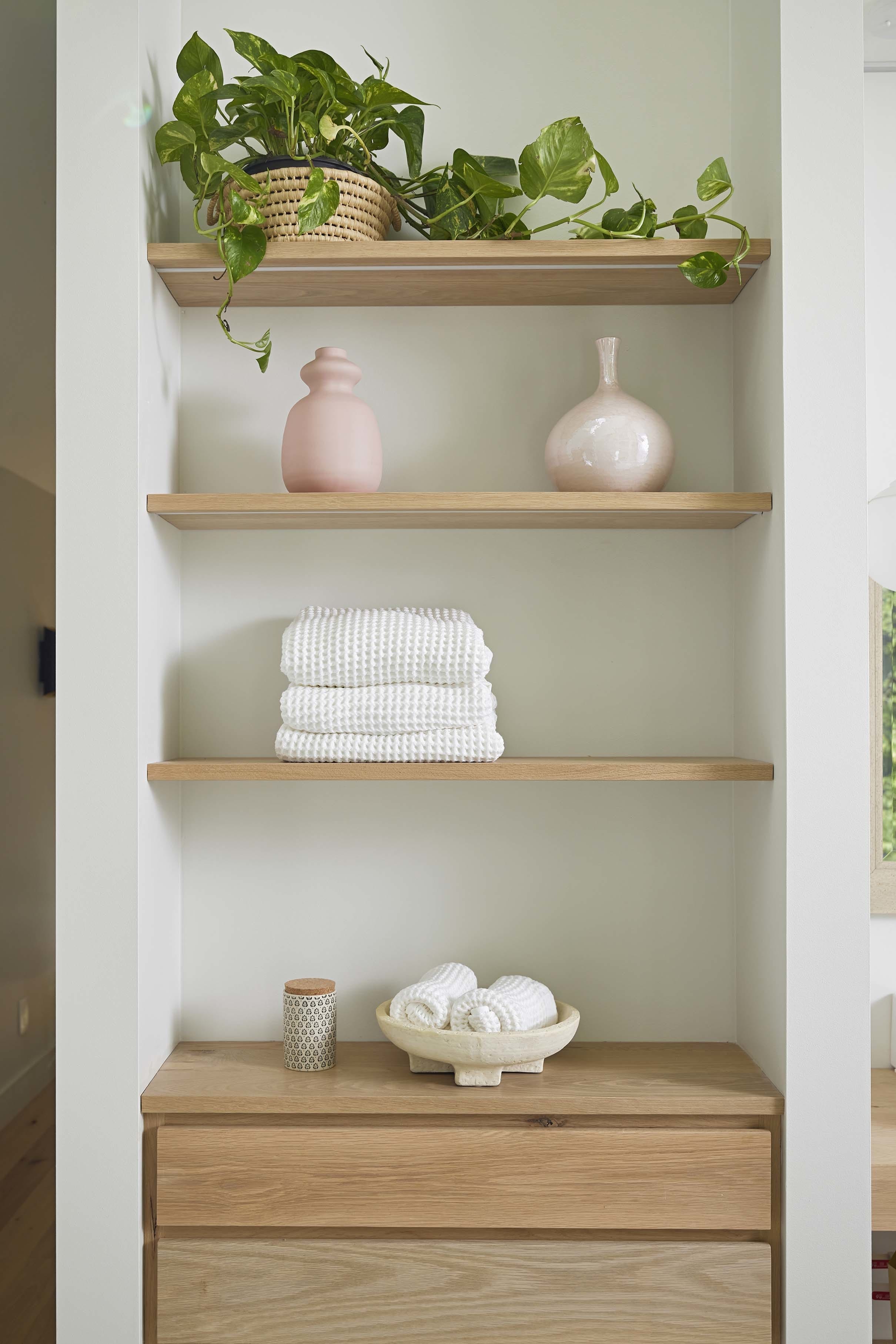 Wooden shelves plant towels vases