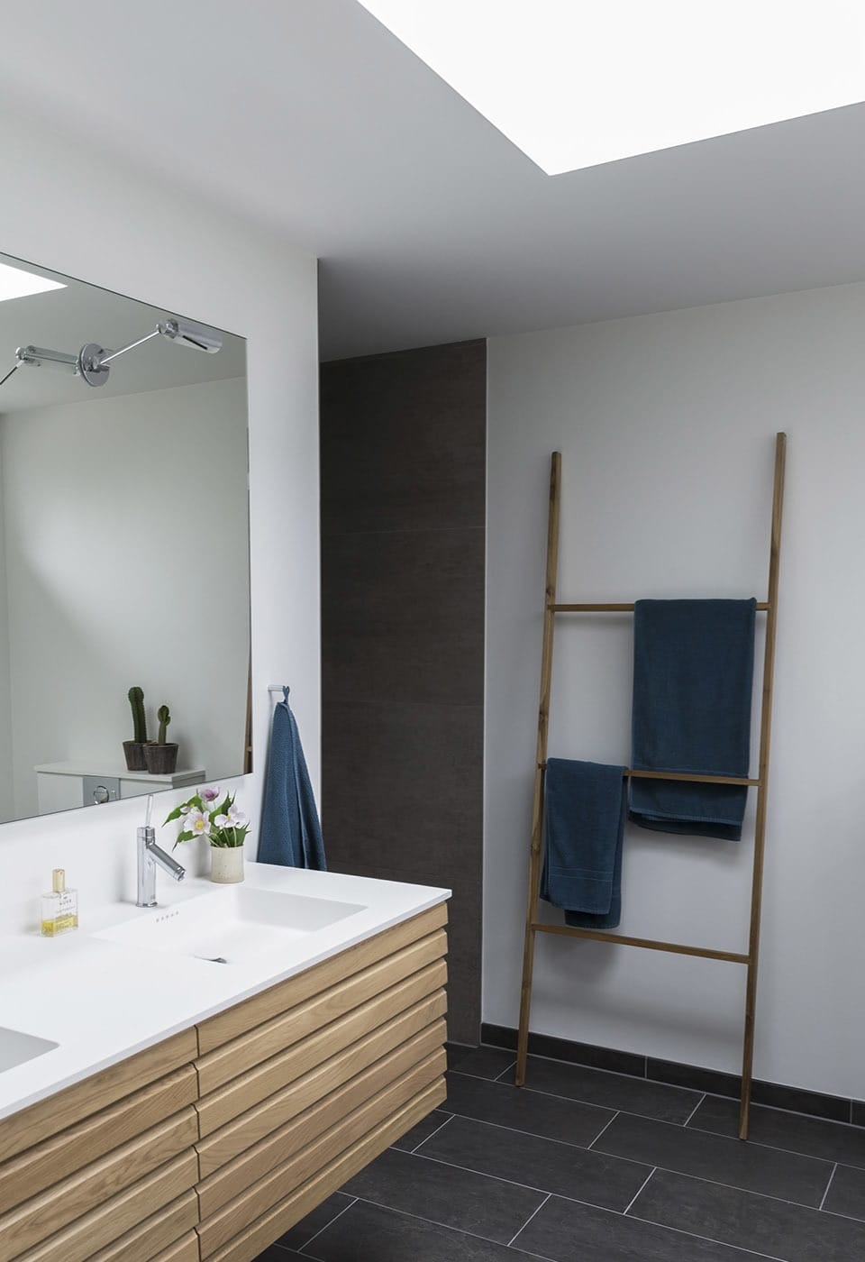 Slate Tile Bathroom Designs : Black Slate Bathroom Floor Ideas Trendecors - Bathroom features slate blue floating washstand topped with white marble over gray herringbone tiles.