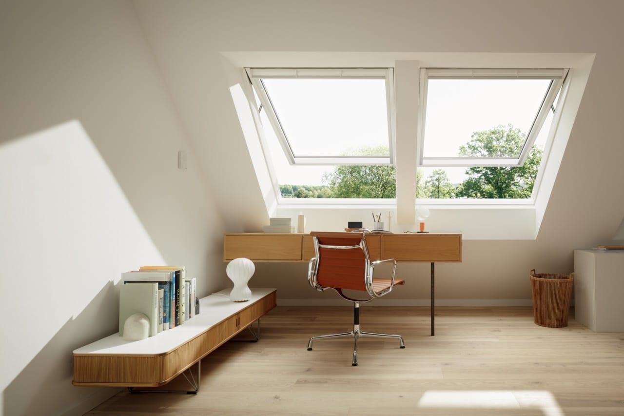 Attic office space with two skylights on a low slanted ceiling