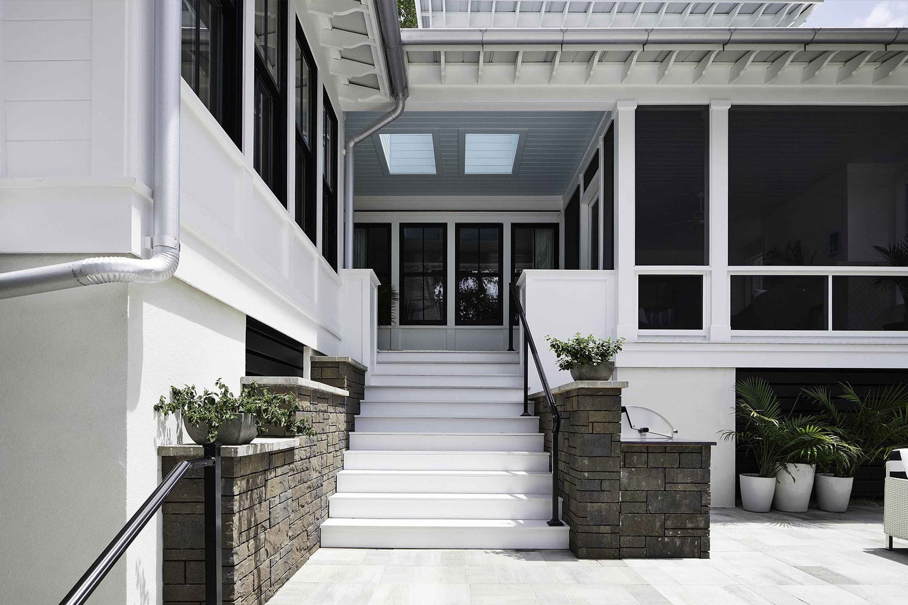 Large home with two skylights over a front porch area