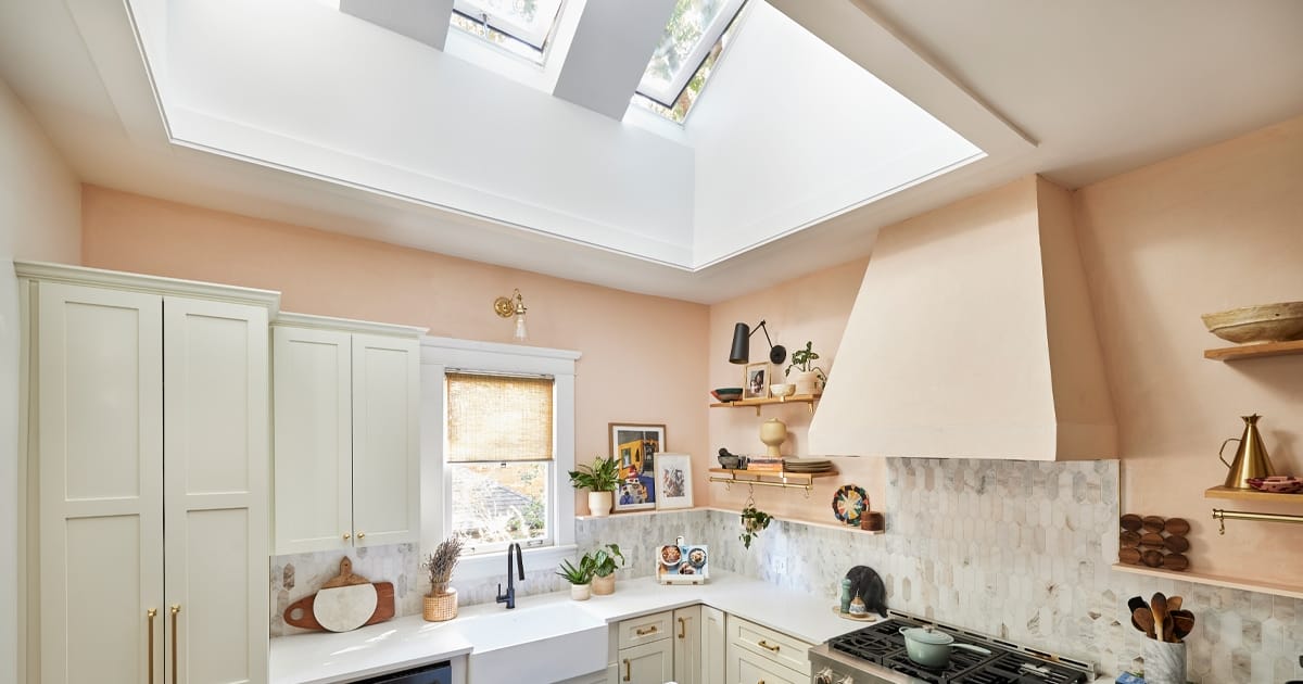 Kitchen With Three Skylights Peach Colored Walls And White Cabinets FB 